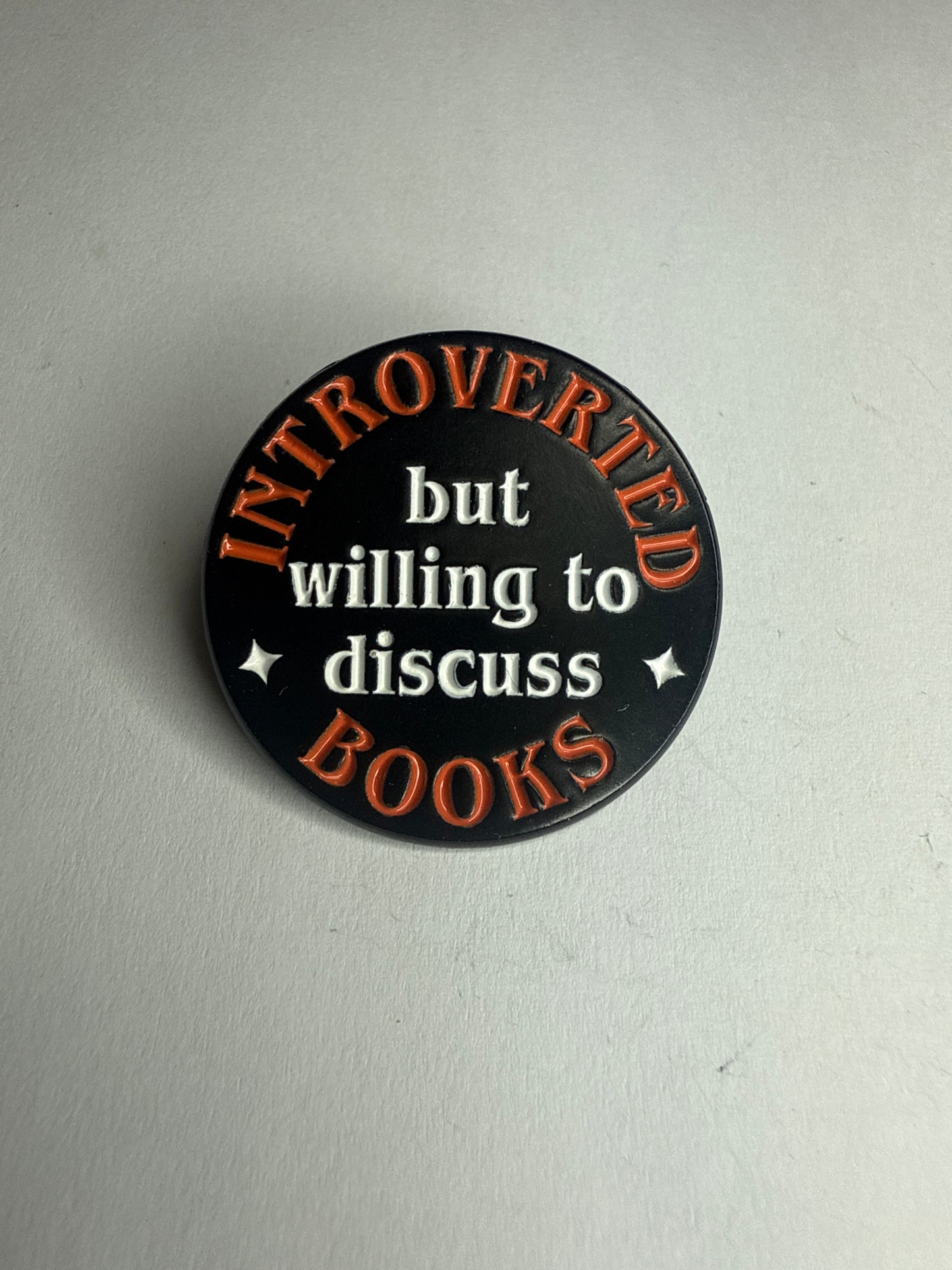 Introverted, but willing to discuss books pin