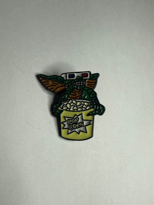 Stripe- popcorn- gremlins enamel pin