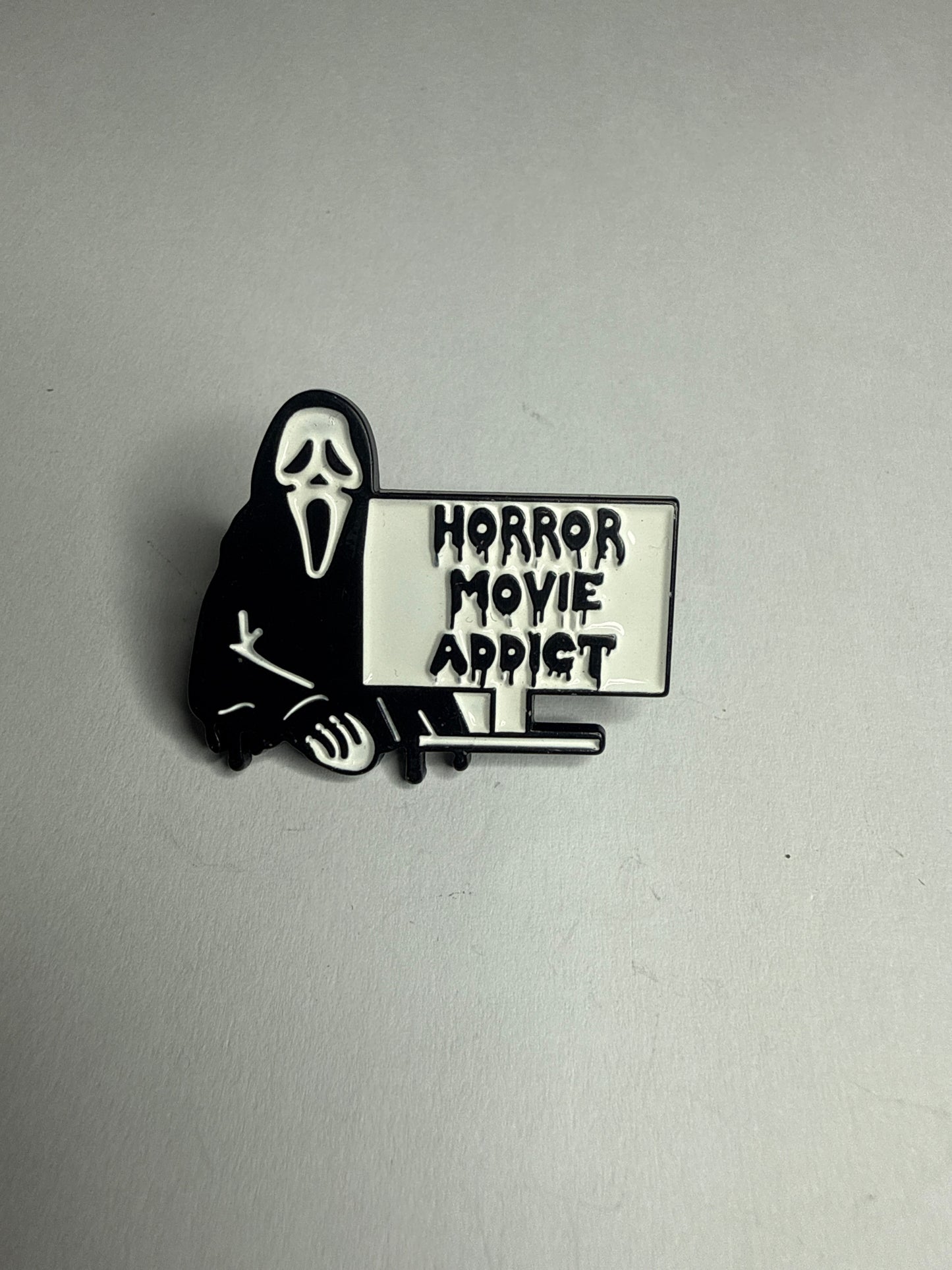 Horror movie addict- large enamel pin
