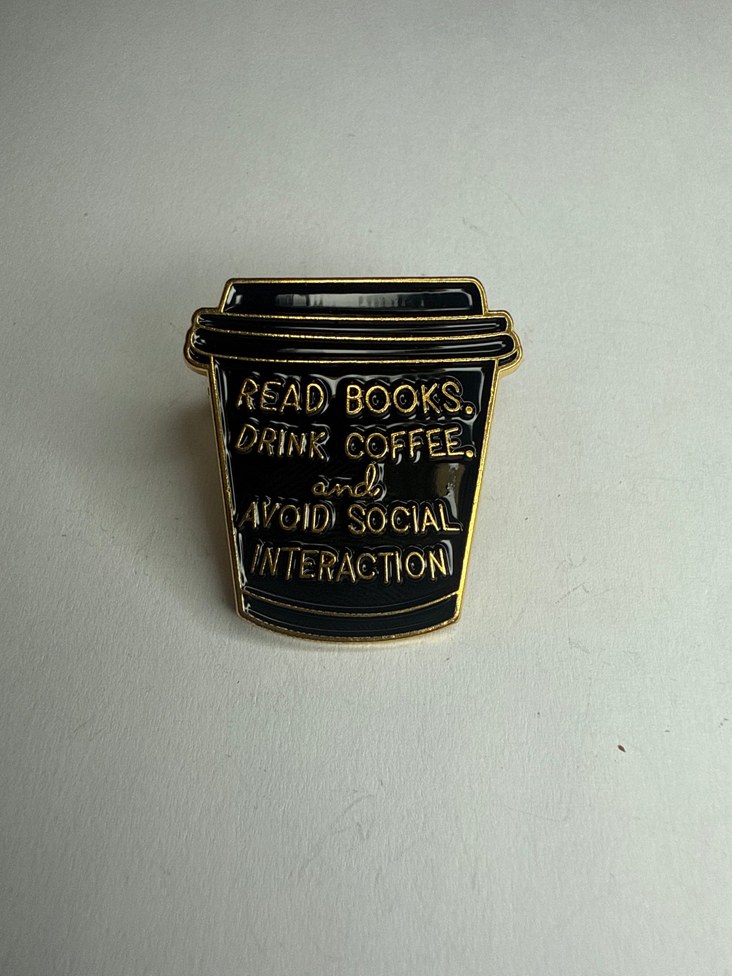 “Read books, drink coffee and avoid social interaction” pin
