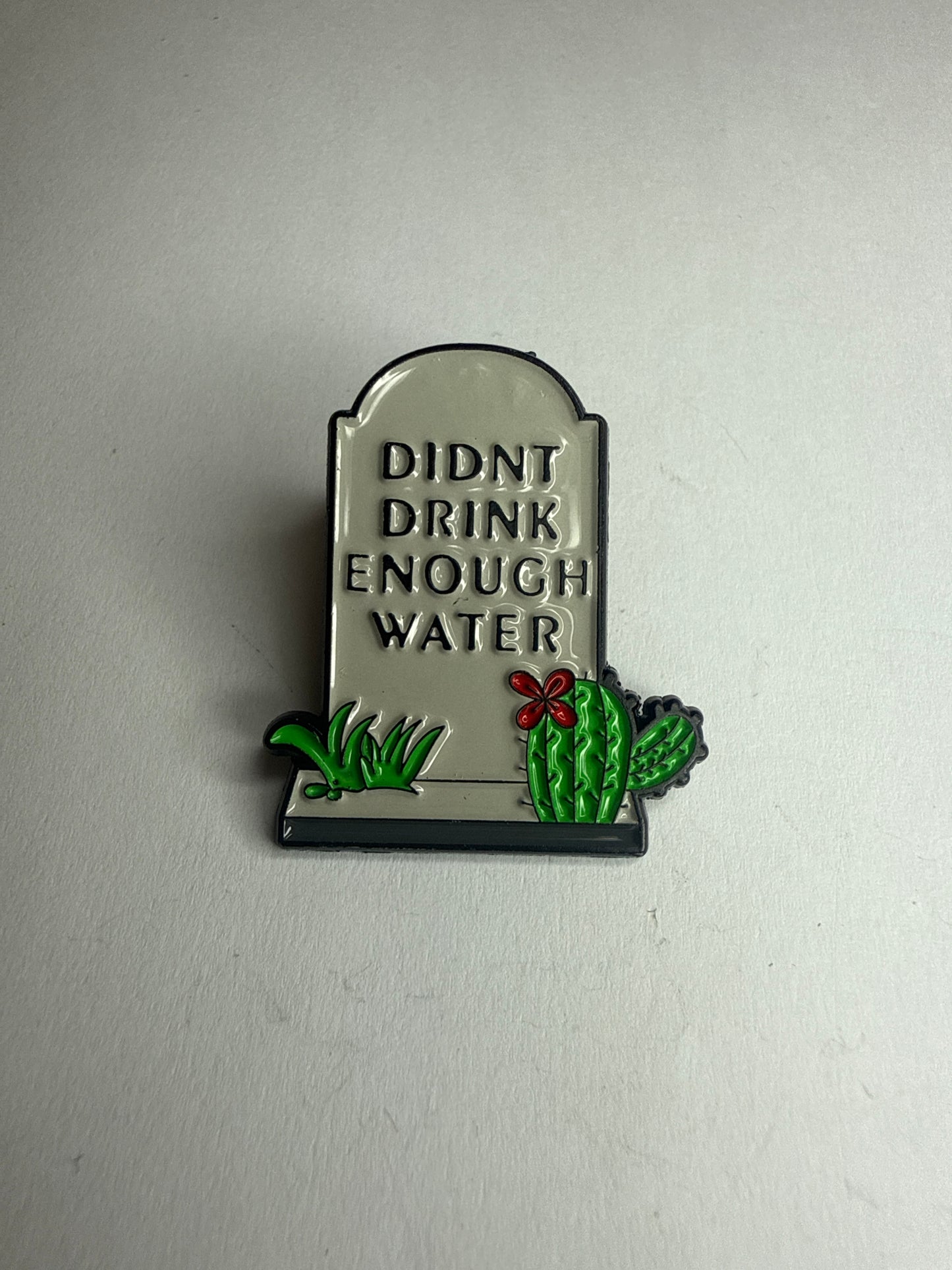 “Didn’t drink enough water” Tombstone pin