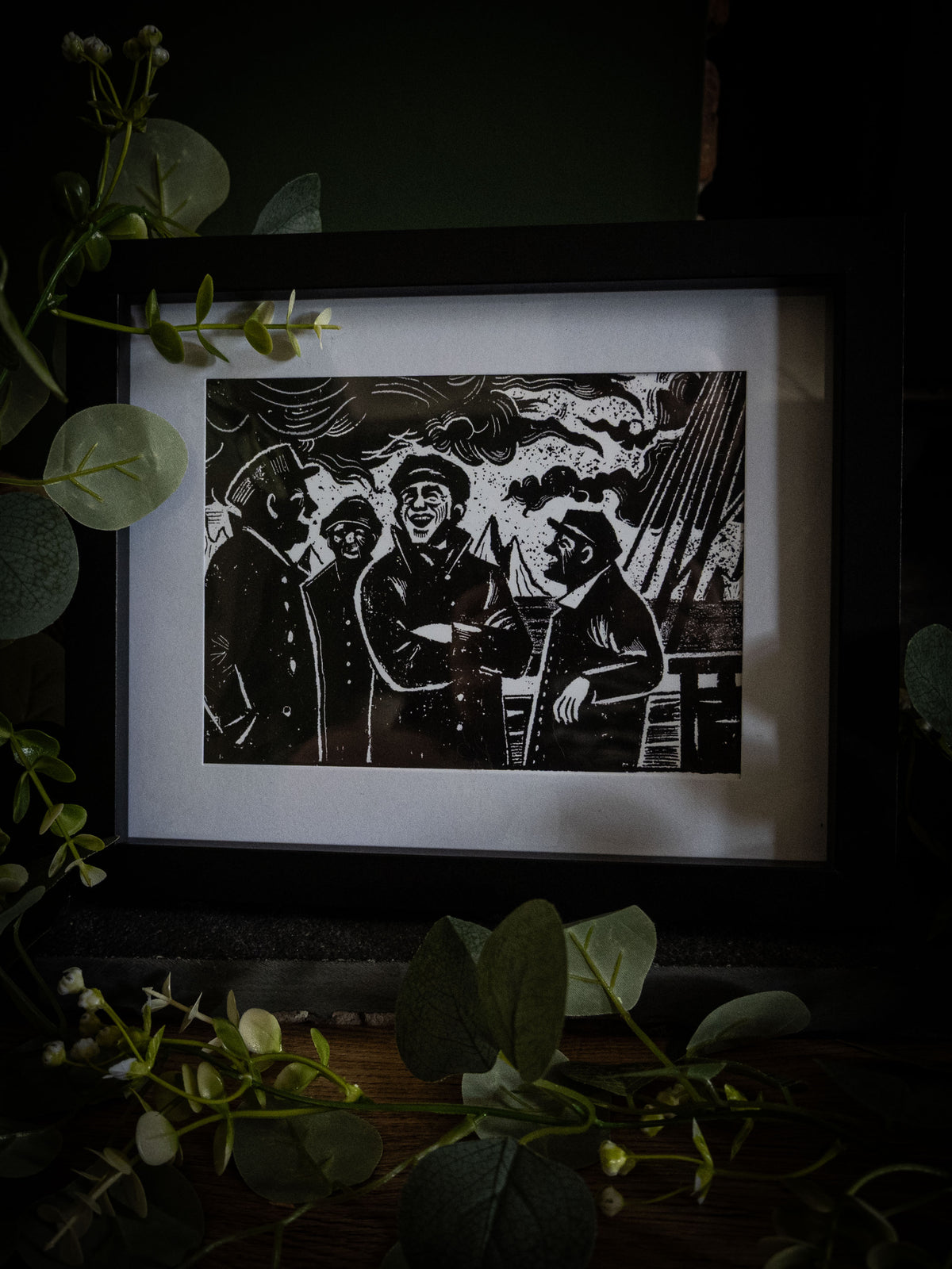 Close-up of The Voyage art print — laughing sailors against stormy sky, high-contrast gothic illustration by Sophie Atkinson