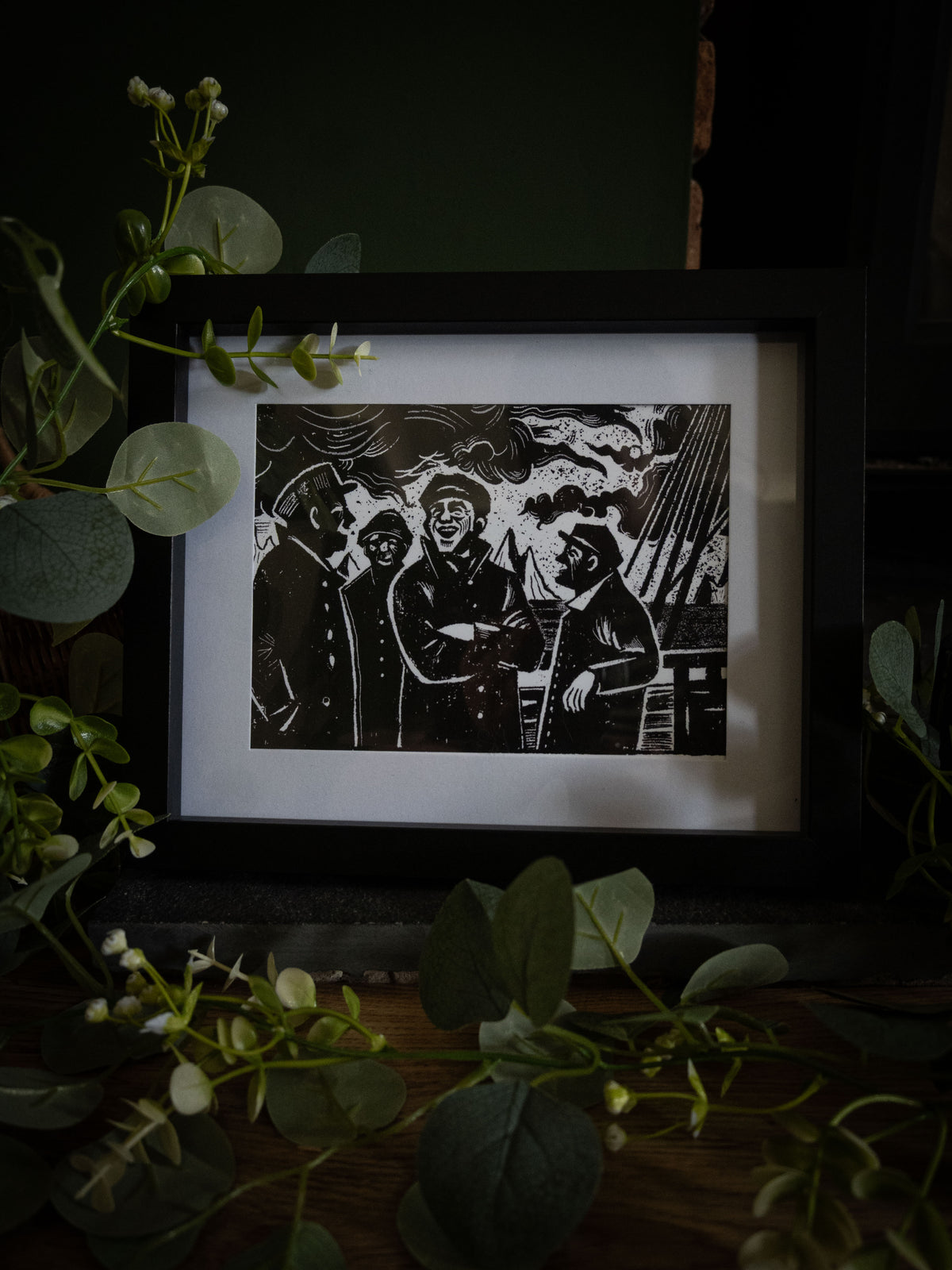 The Voyage art print surrounded by greenery — Walton's crew before the Arctic, bold gothic illustration by Sophie Atkinson