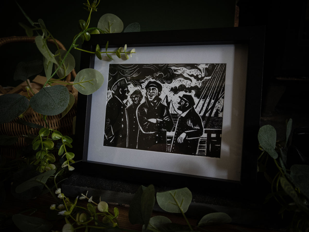 The Voyage Frankenstein art print in black frame surrounded by greenery — sailors and ship rigging, gothic illustration by Sophie Atkinson