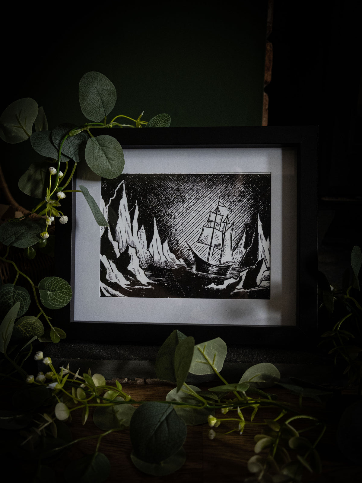 The Arctic art print wide shot with eucalyptus foliage — Walton's ship in frozen passage, bold black and white gothic illustration by Sophie Atkinson