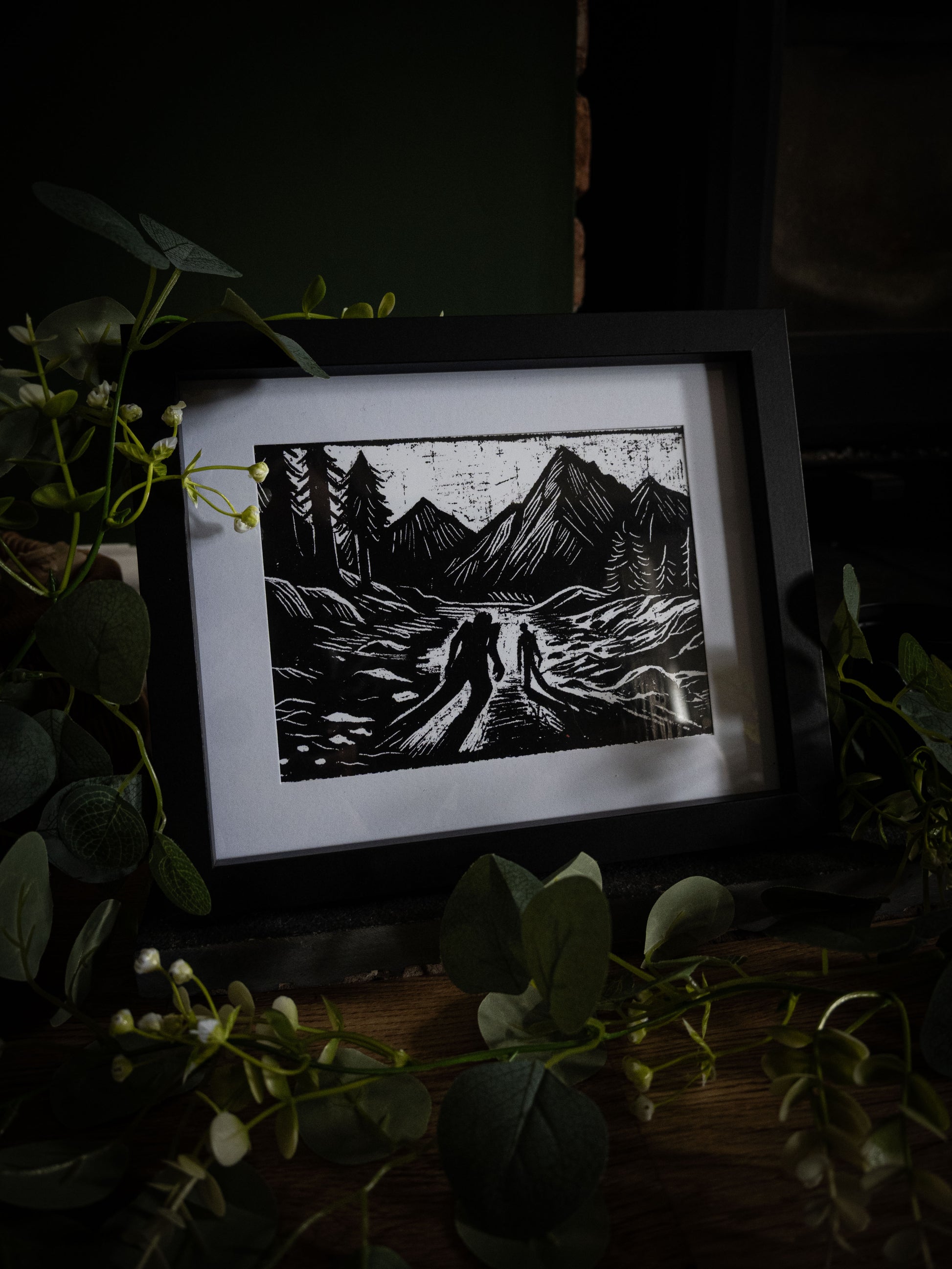 The Alpine Pass giclée print displayed with winter foliage — Frankenstein Alpine pursuit scene, gothic artwork by Sophie Atkinson