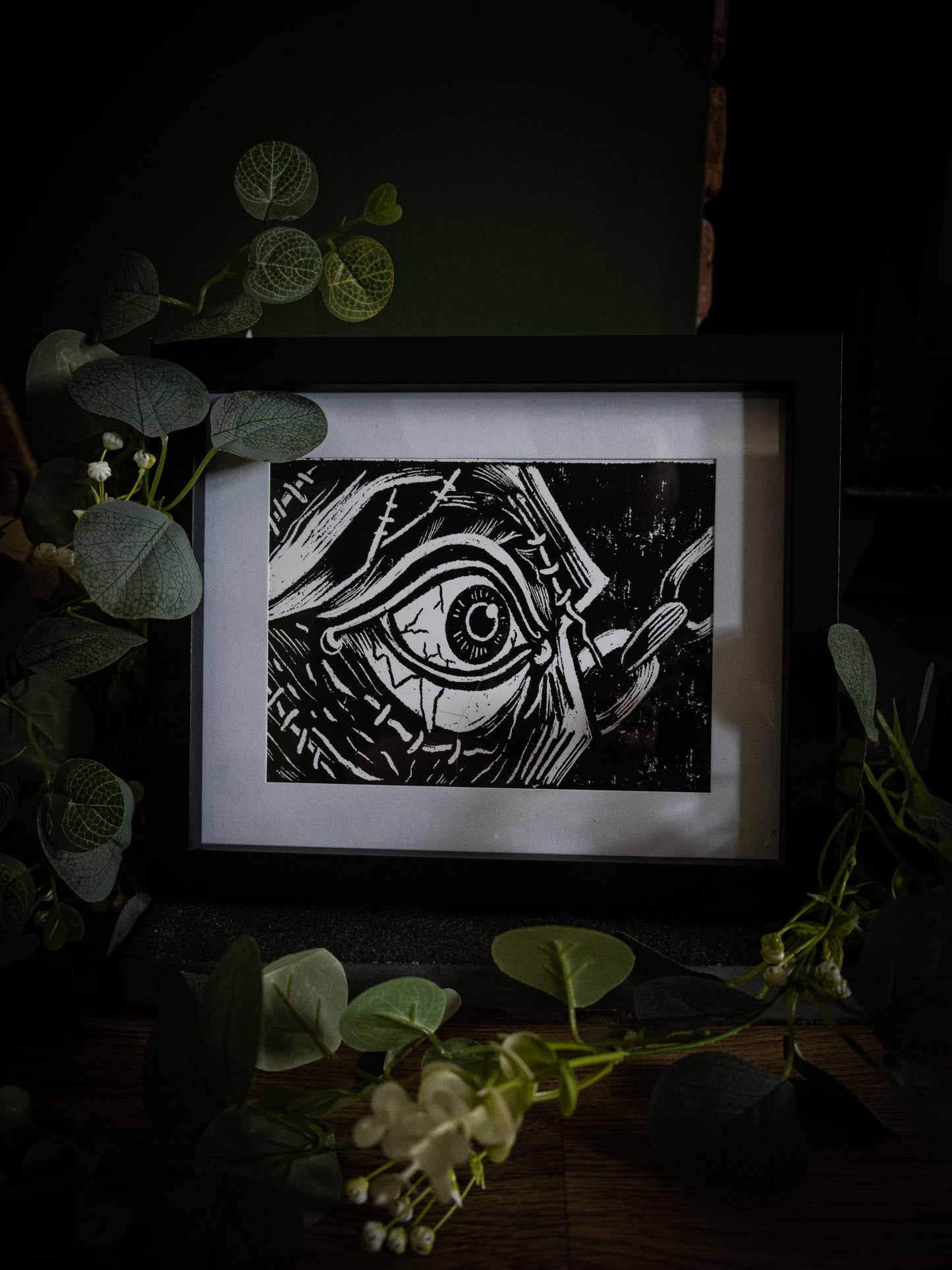 Framed gothic art print of the creature's stitched eye opening, from Sophie Atkinson's Frankenstein Illustrated series