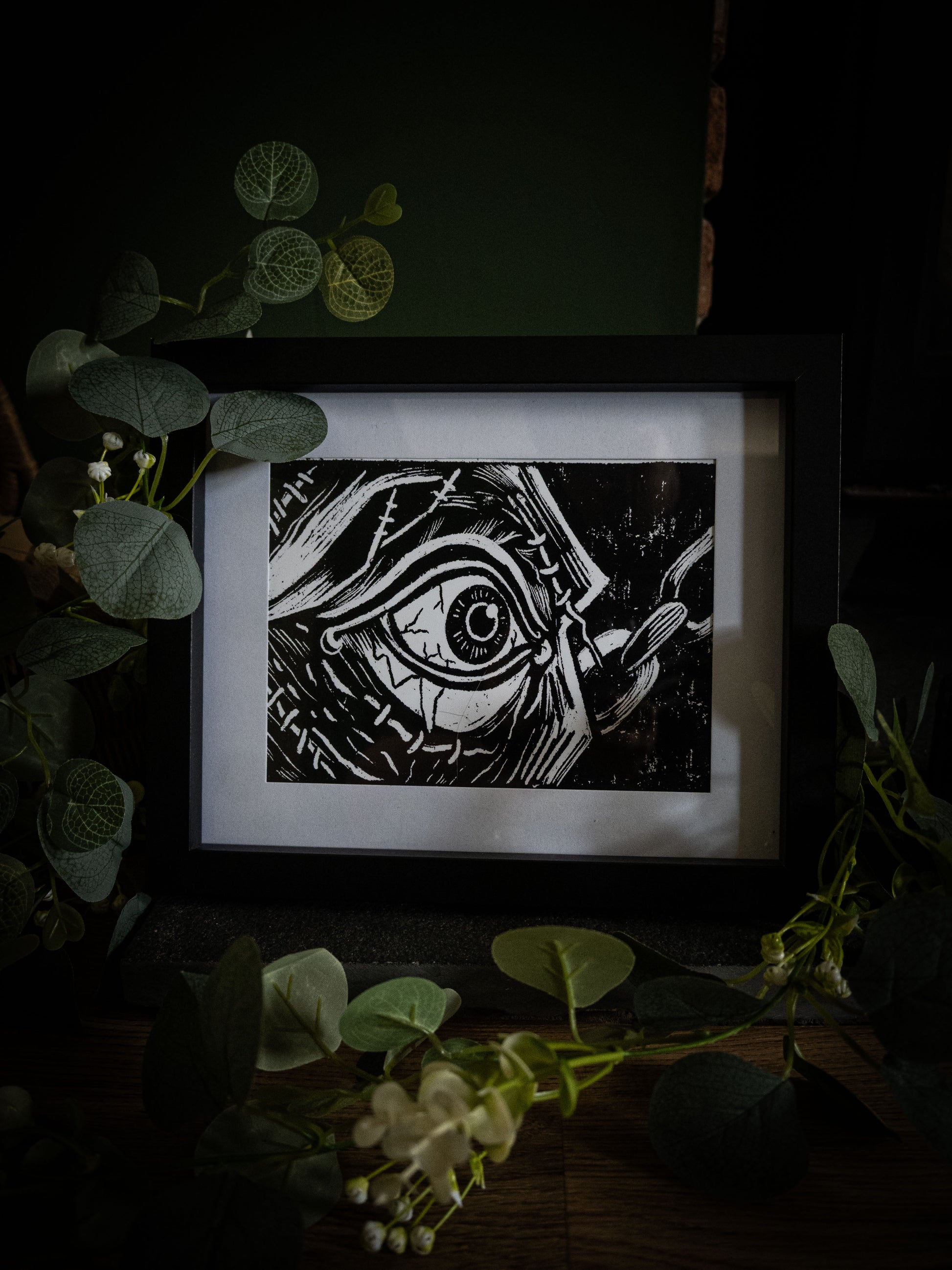 Framed gothic art print of the creature's stitched eye opening, from Sophie Atkinson's Frankenstein Illustrated series