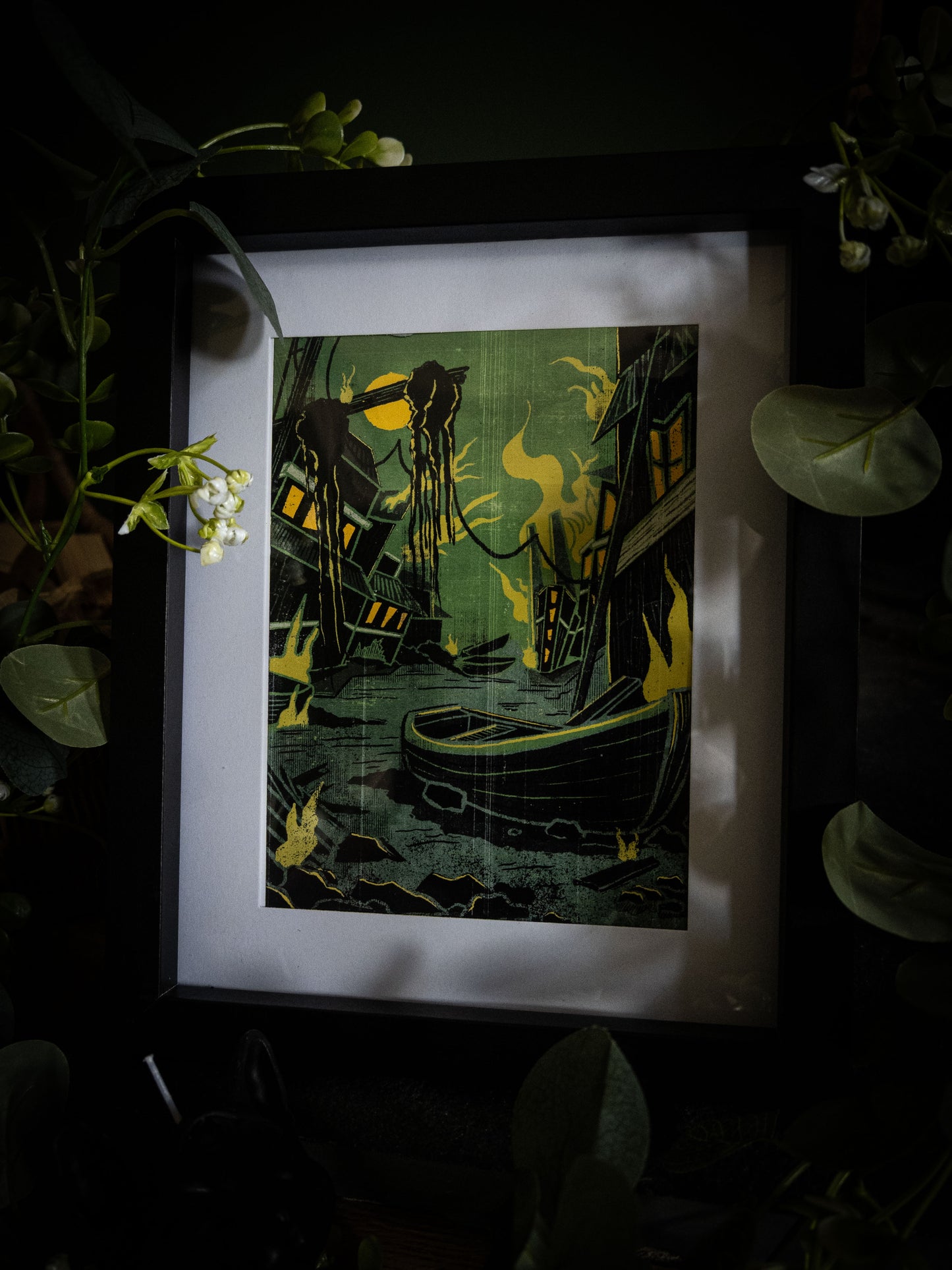 Sophie Atkinson Illustration – Something Wrong in Innsmouth Lovecraft print in black frame with botanical styling and wicker basket, full composition view
