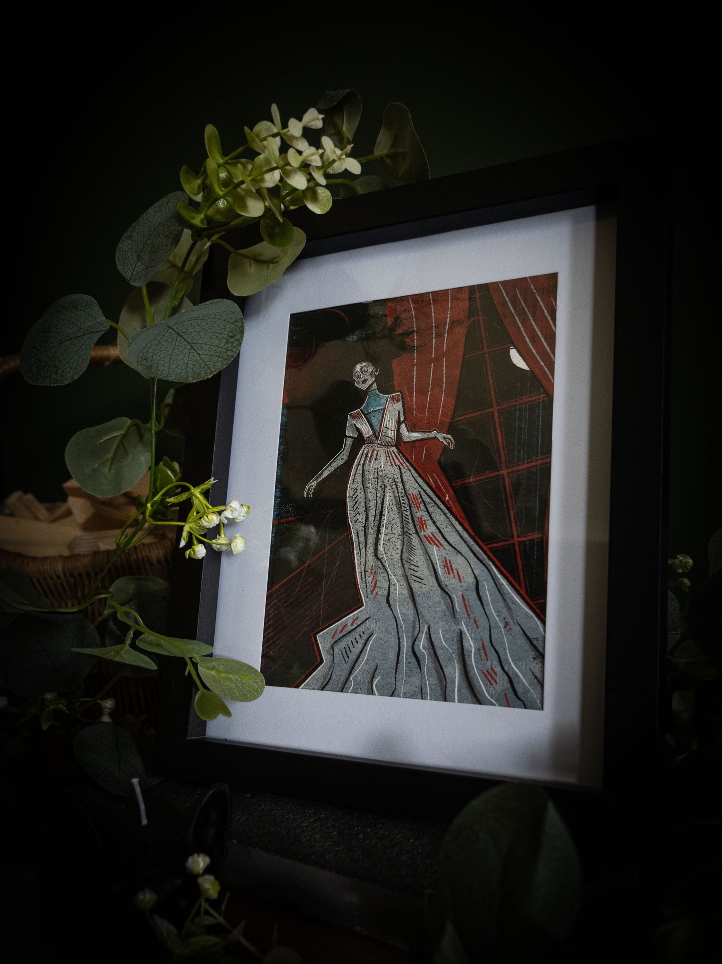 Framed Lady Ligeia gothic print – spectral figure in flowing gown with crescent moon, dark moody product photography with eucalyptus