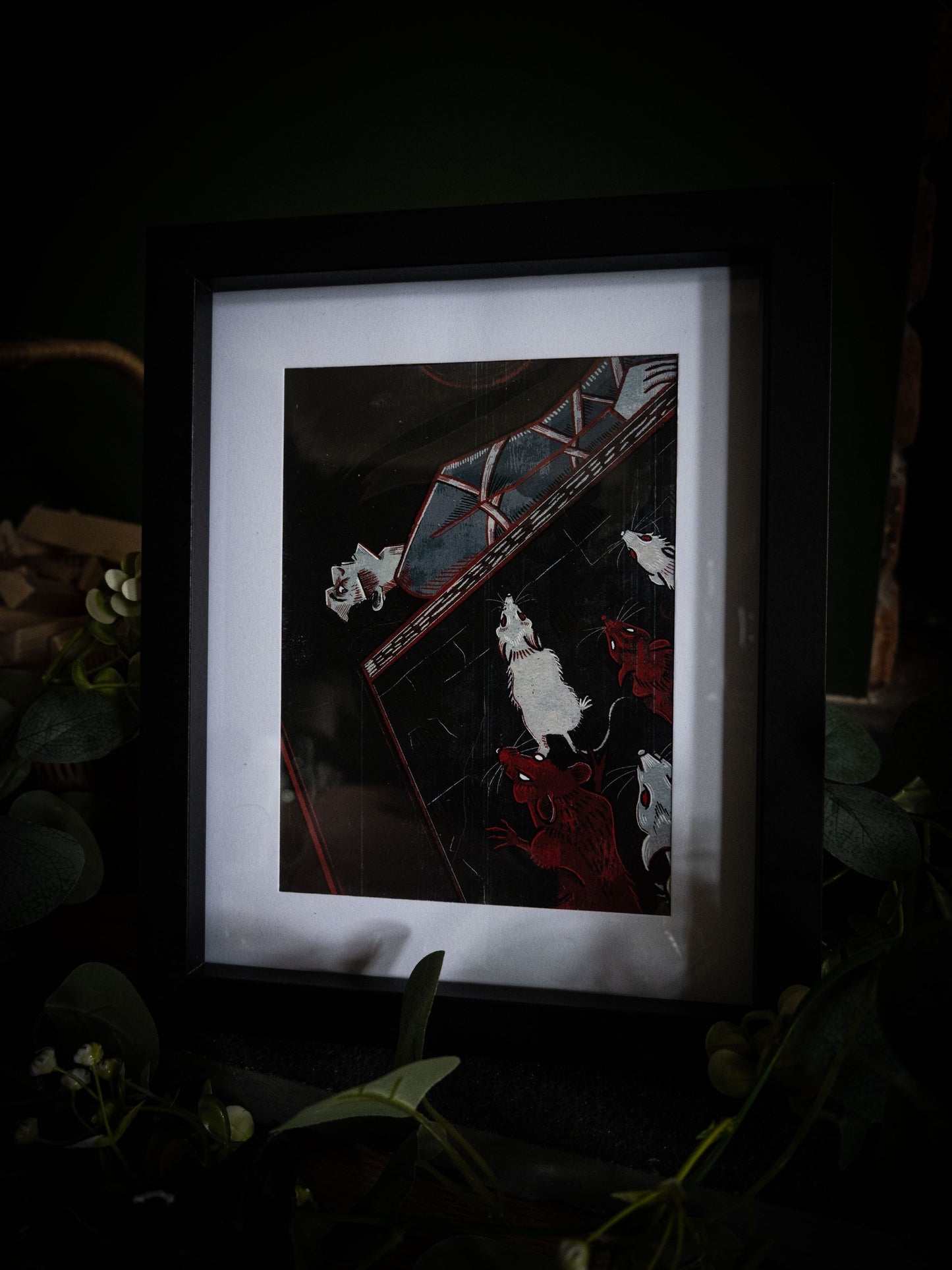 The Pit and the Pendulum illustrated Poe anthology art print in black frame, moody dark background with botanical props, pendulum and rats in dramatic composition