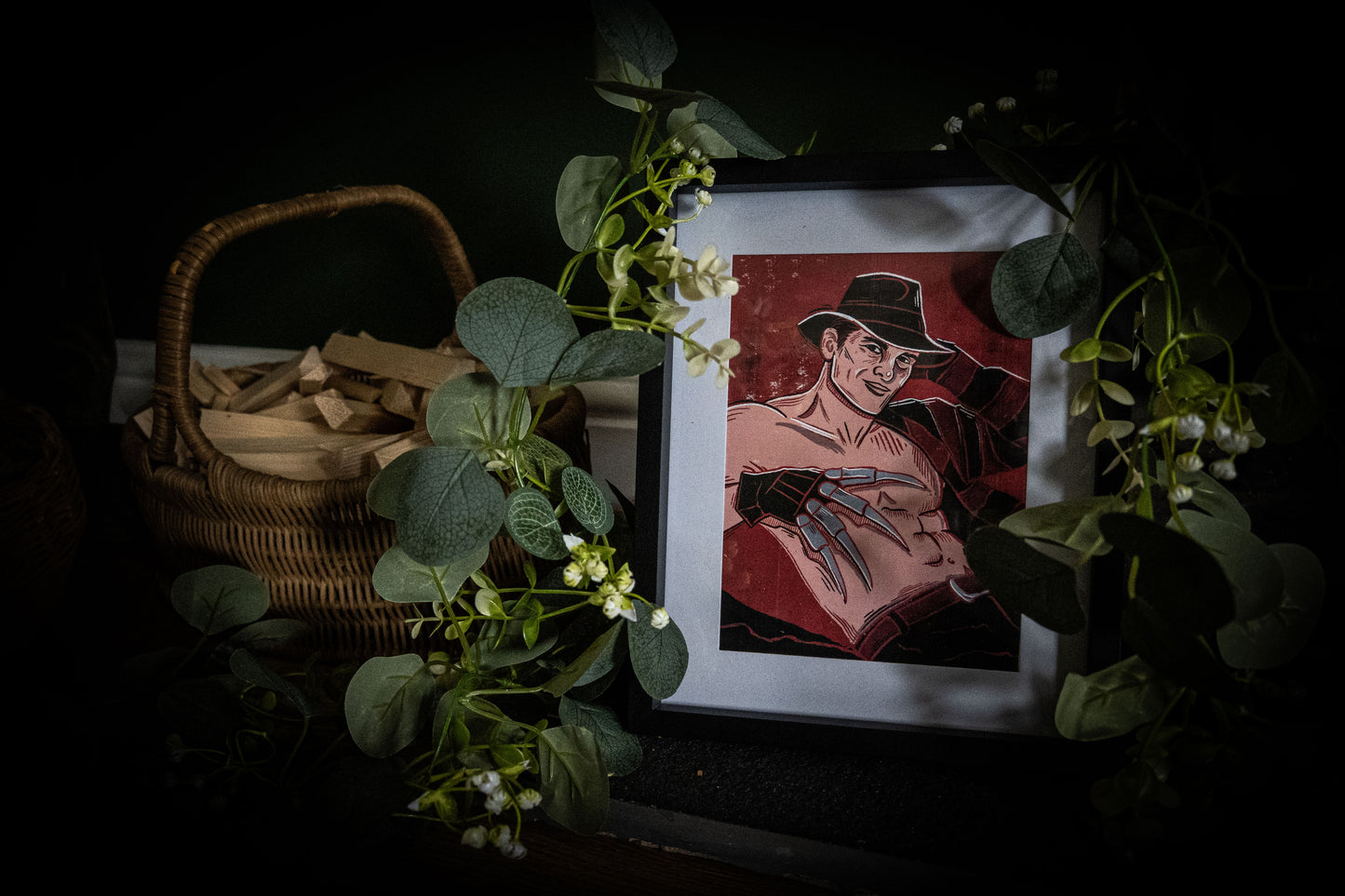 Freddy Krueger horror pinup art print in black frame with eucalyptus — gothic wall art by Sophie Atkinson