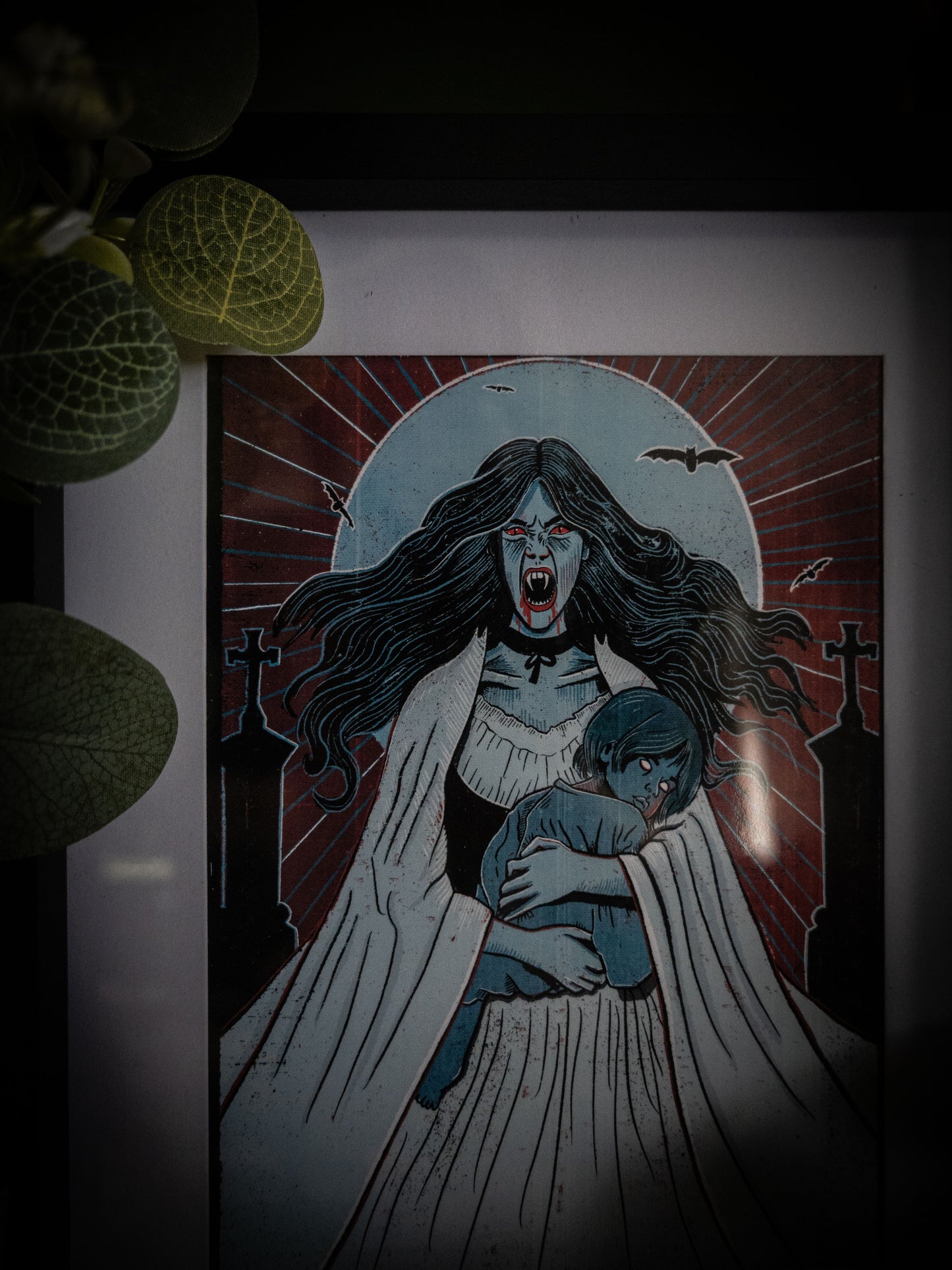Lucy Westenra Dracula art print in black frame with white flowers and eucalyptus