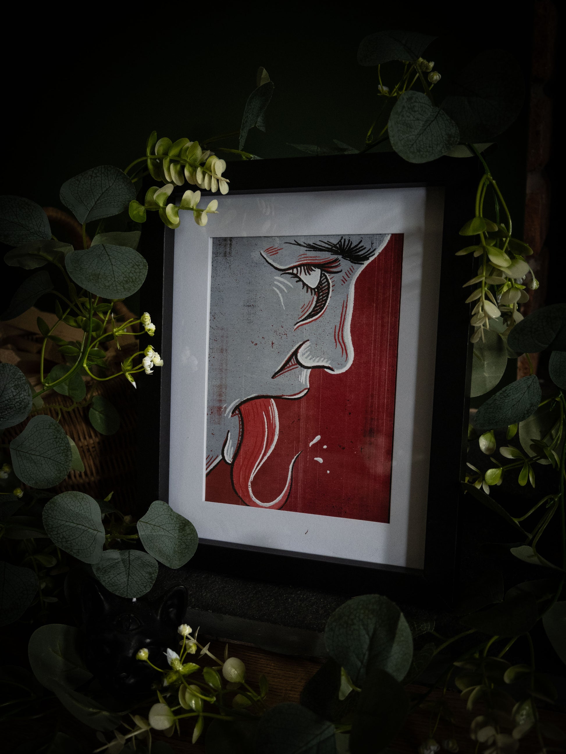 Speak No Evil fine art print – close-up eye, nose and tongue in linocut style, dark moody product photography